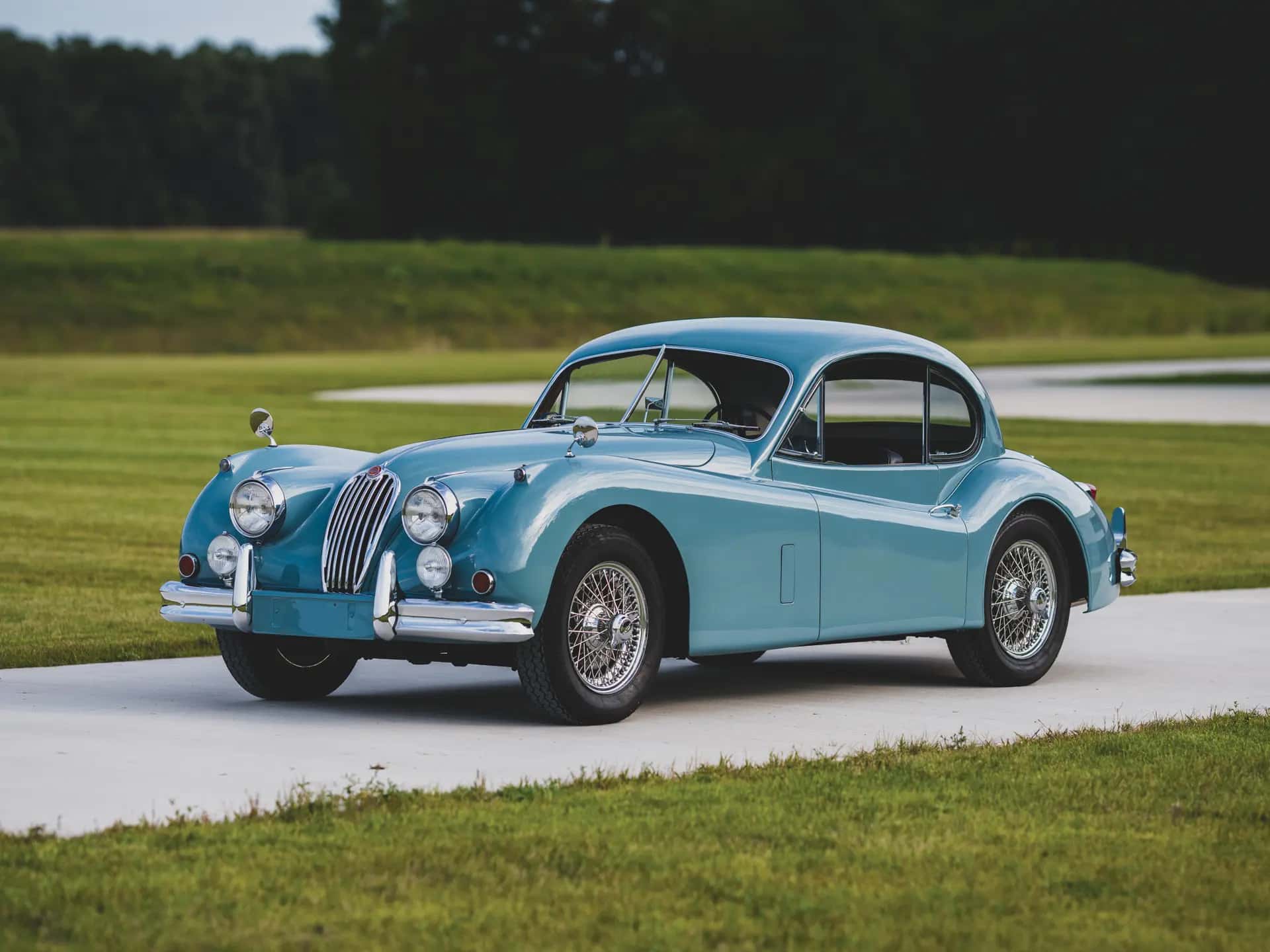 1955 Jaguar XK 140 MC Fixed Head Coupe sold for $89,600