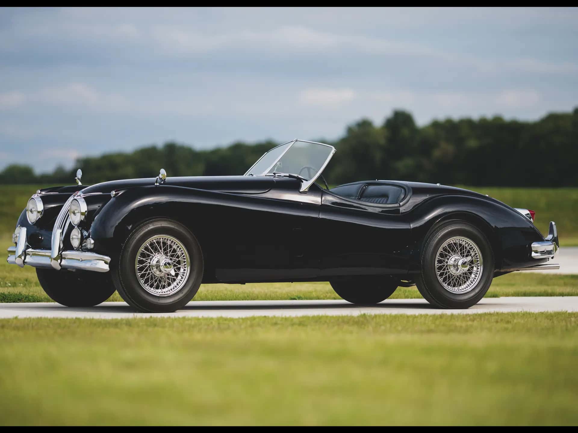 1956 Jaguar XK 140 MC Roadster sold for $173,600