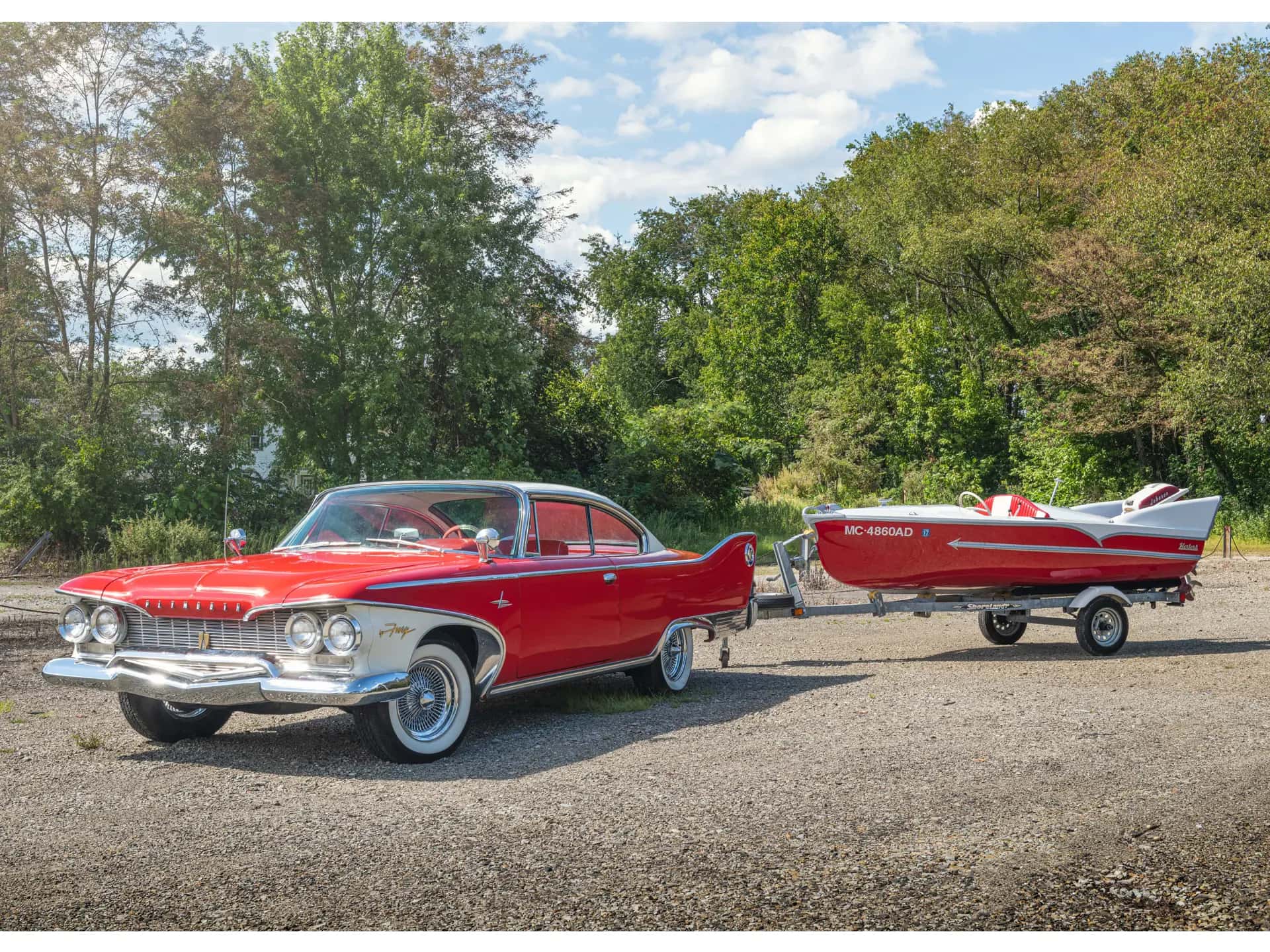 1960 Plymouth Fury Two-Door Hardtop with 1957 Herter's Boat sold for $61,600